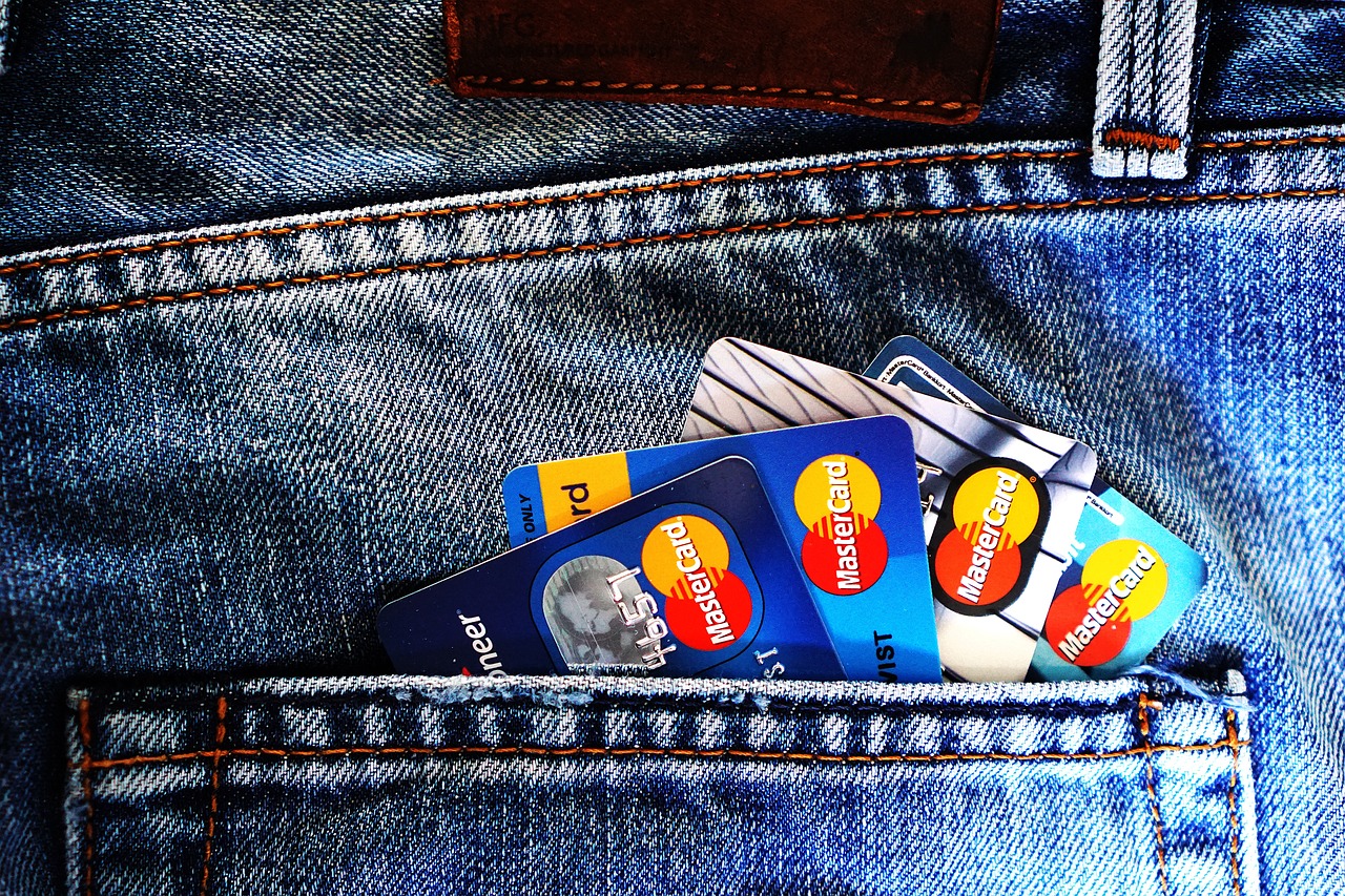 Back pocket with credit cards offering rewards shown sticking out